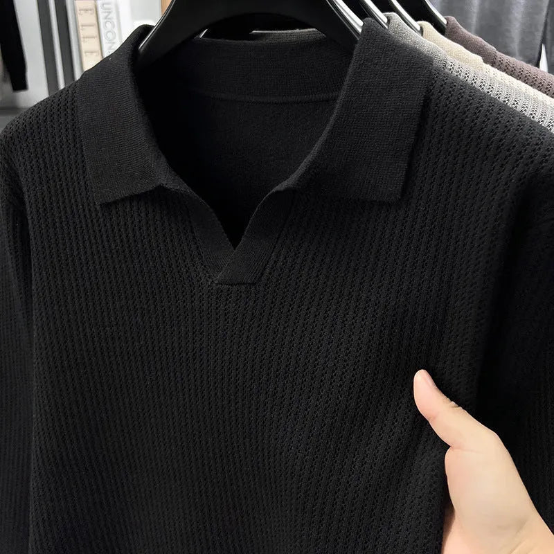 Men's loose fit casual green pullover sweater for autumn layering on a hanger.
