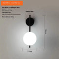 Nordic wrought iron wall lamp in black with milky white glass shade, 12x30cm, warm light