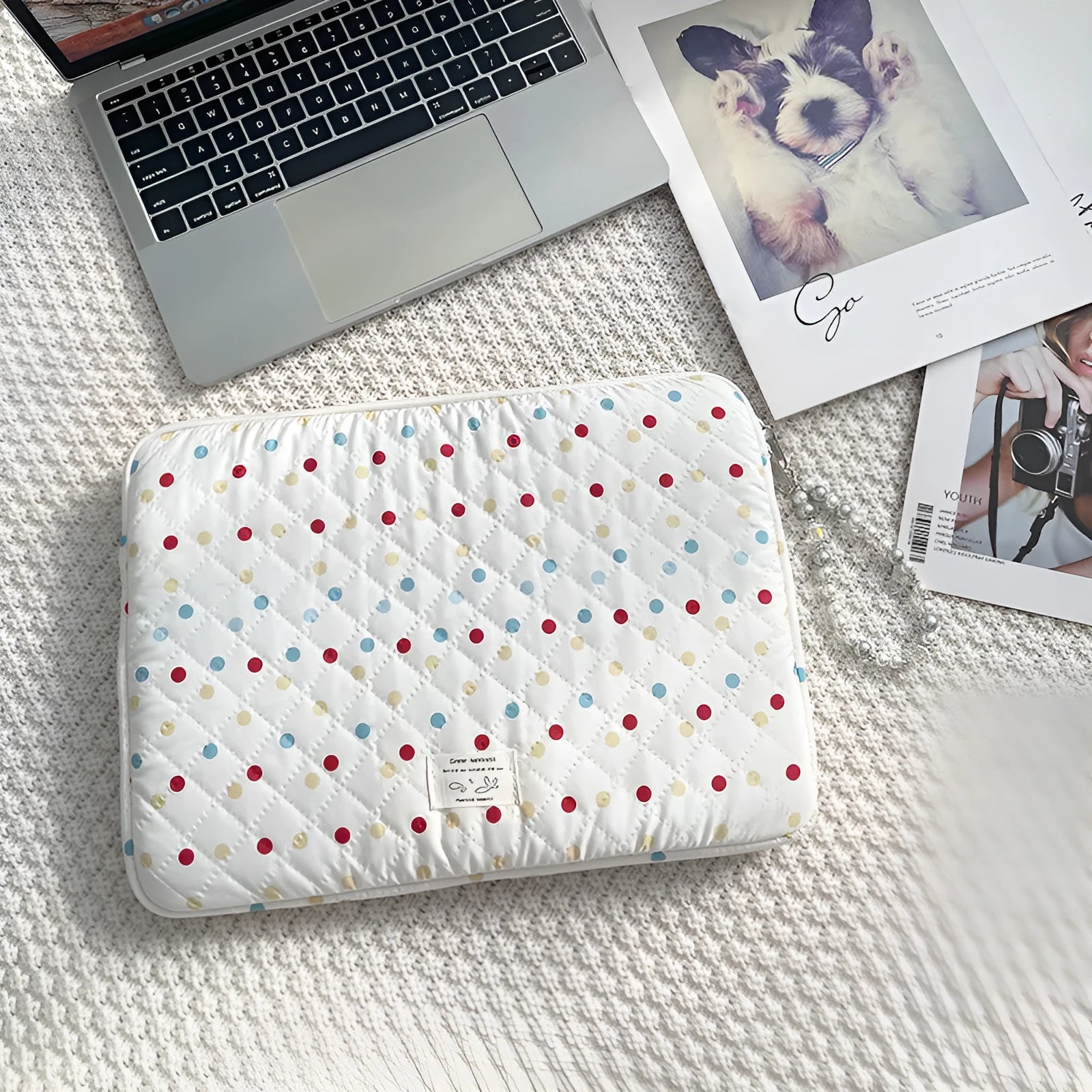 Women's polka dot polyester laptop bag showing front view with storage compartments