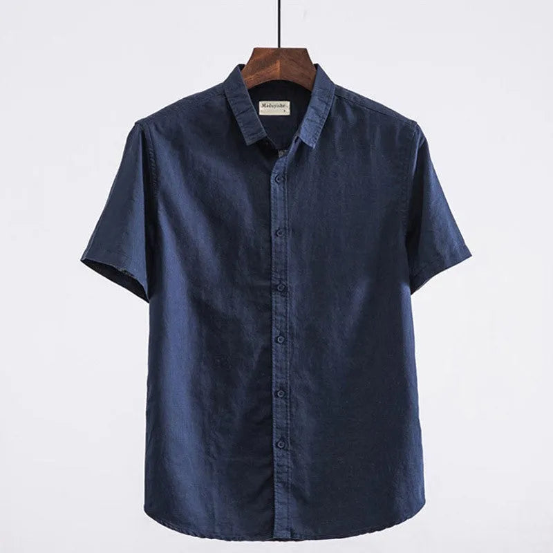 Men's light blue linen short sleeve shirt with a square collar on a hanger.