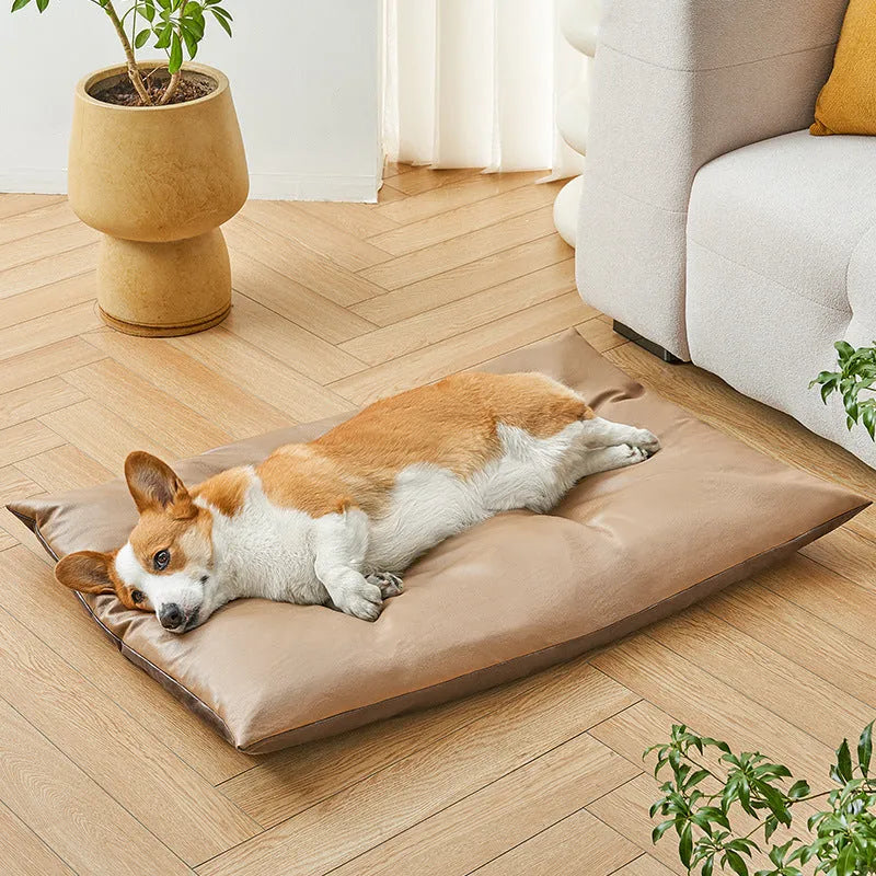 Blue plush fabric pet sleeping mat for cats or small dogs shown in a home setting.