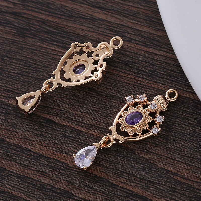 Small crown hollow water drop pendant with micro inlaid zircon details in five colours.