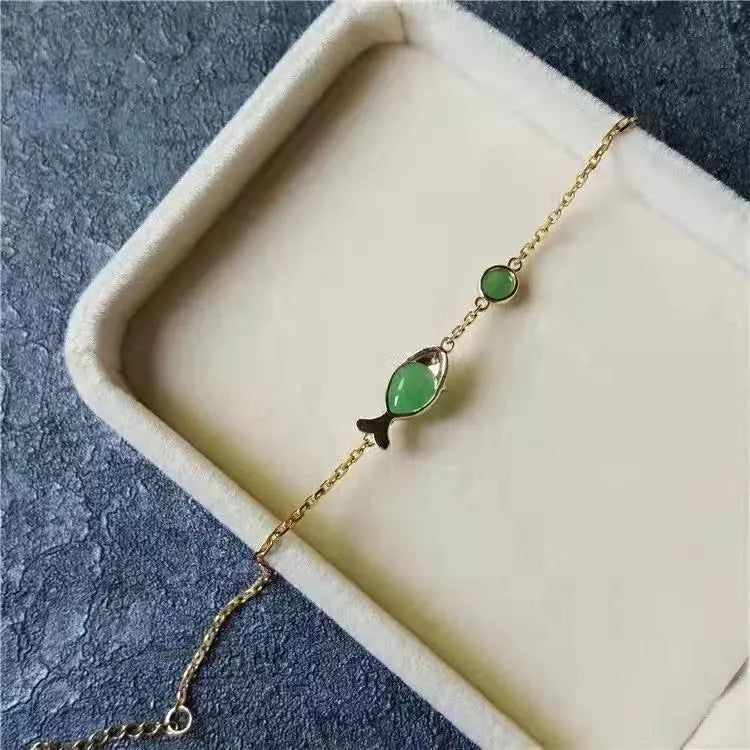 Yellow gold electroplated copper bracelet with plastic elements in retro style