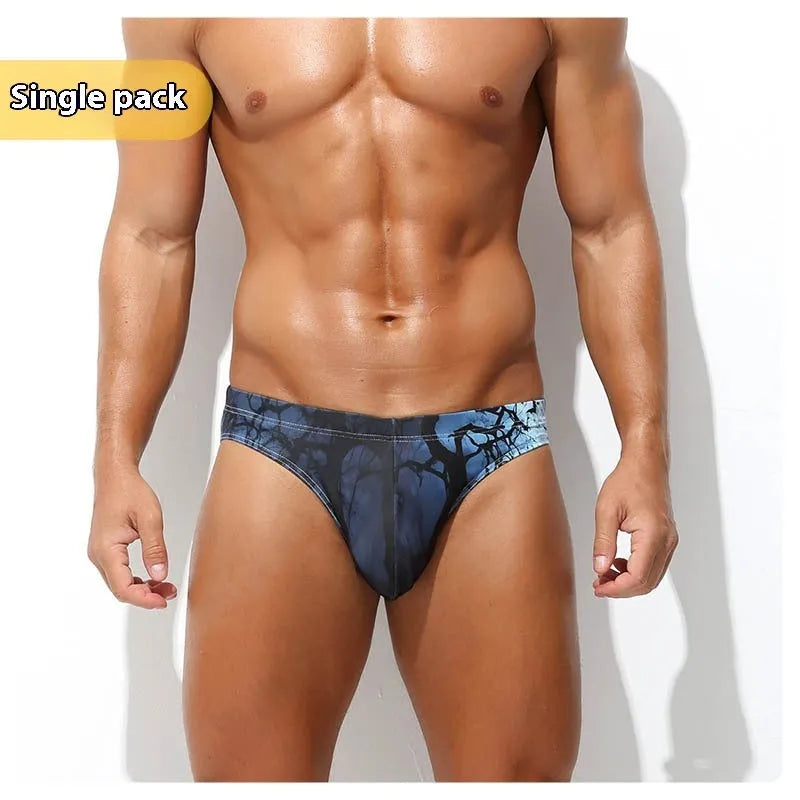 Men's low-waisted quick-drying briefs with digital print design on polyester fabric.