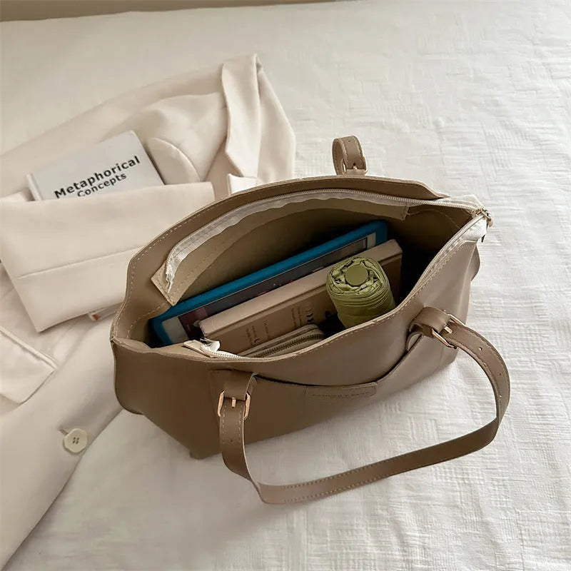 Women's structured PU tote bag in a horizontal square shape with double shoulder straps, shown in a neutral colour.