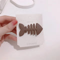 Fishbone pattern plastic barrette with duckbill clip in minimalist candy colour