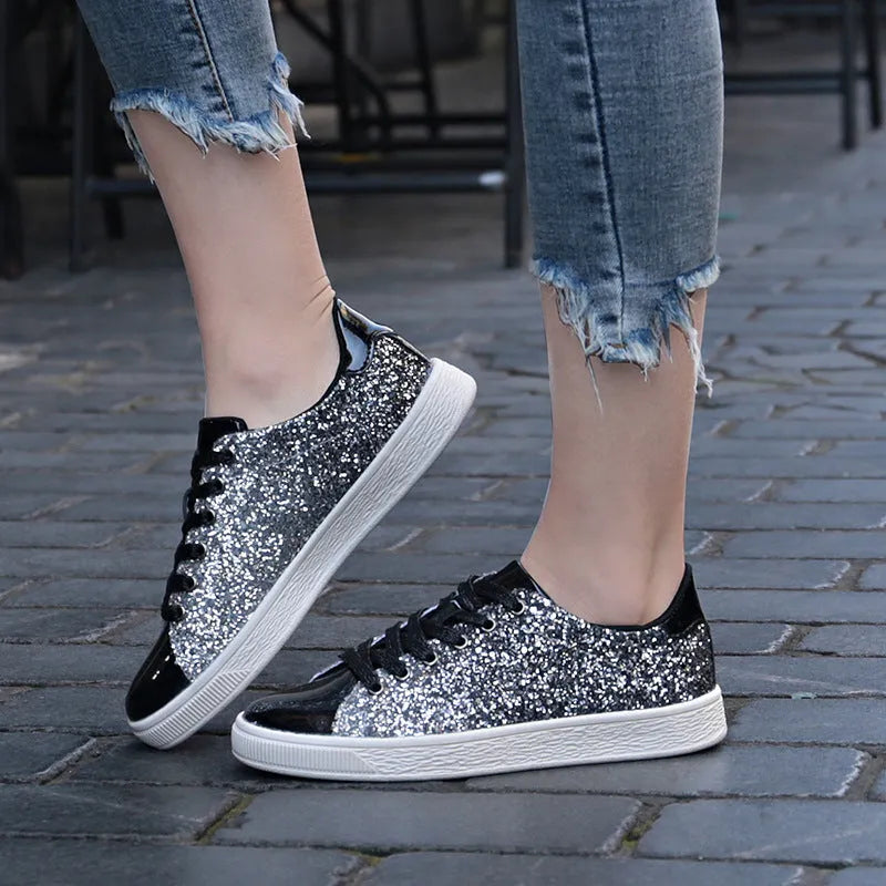 Women's black low-top lace-up shoes with glittering sequins on the upper.
