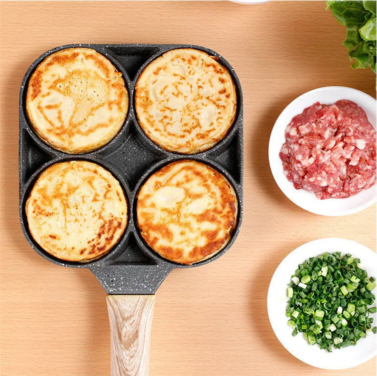 Non-stick egg dumpling frying pan in black aluminium with two holes for cooking breakfast burgers