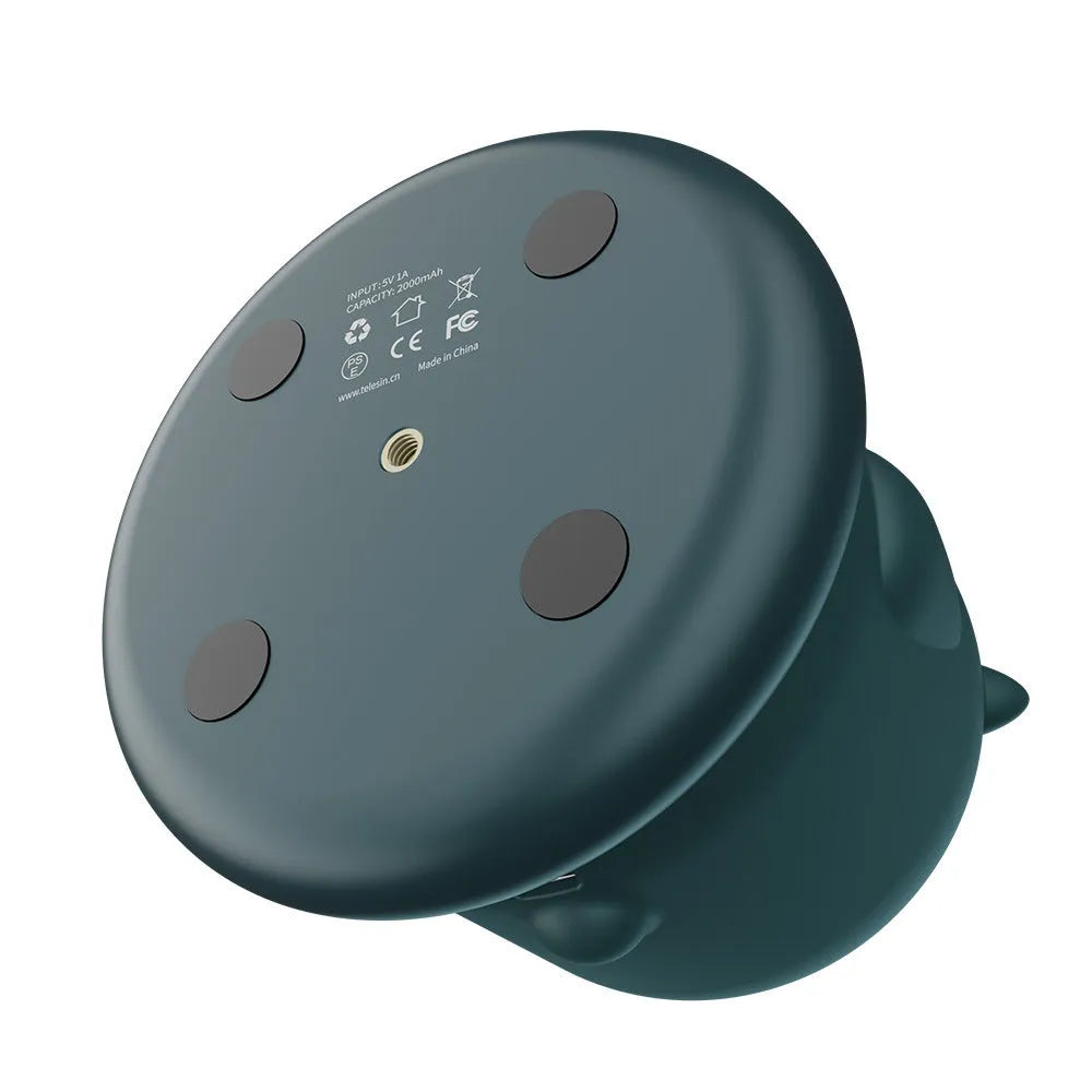 Dark green intelligent gimbal with AI face tracking and 360-degree rotation on a tripod.