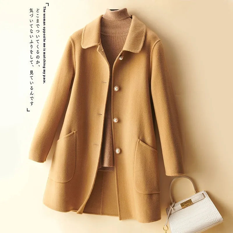 Women's wool mid-length coat with doll collar and pearl buckle in solid colour options