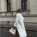 White women's sweater cardigan jacket with extended length and loose fit