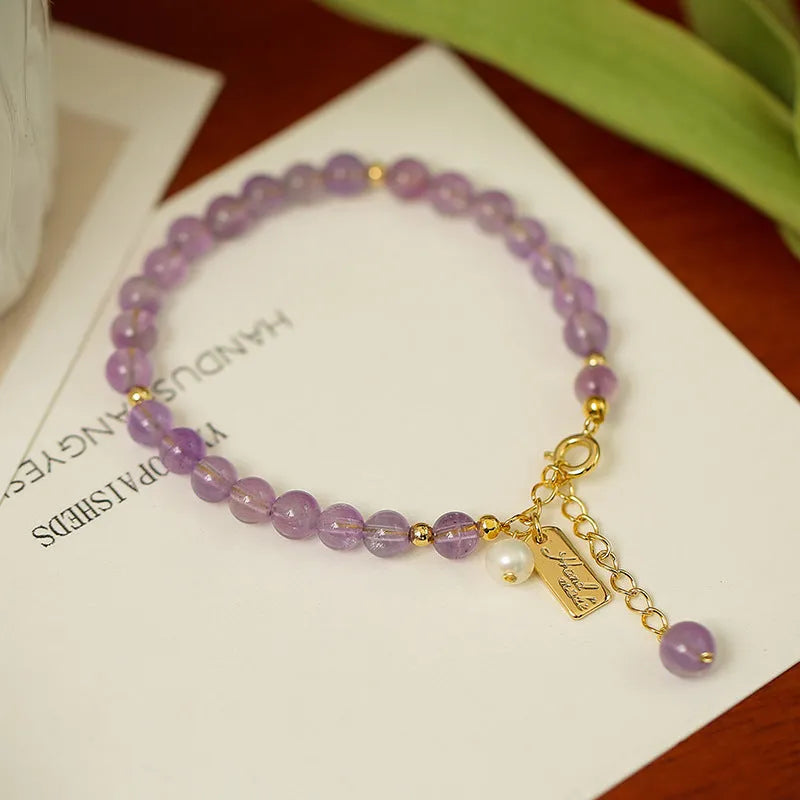 Natural crystal women's bracelet with lavender amethyst stones and animal/Zodiac motif in dark and light colour variations