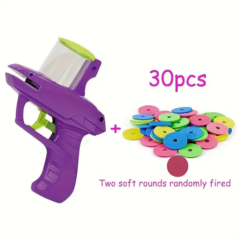 Green and purple manual cat toy launcher with foam discs for indoor pet play