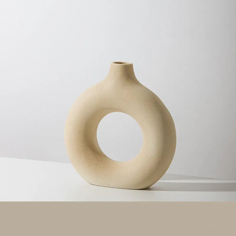 Unglazed porcelain biscuit vase with frosted particle surface in neutral colour