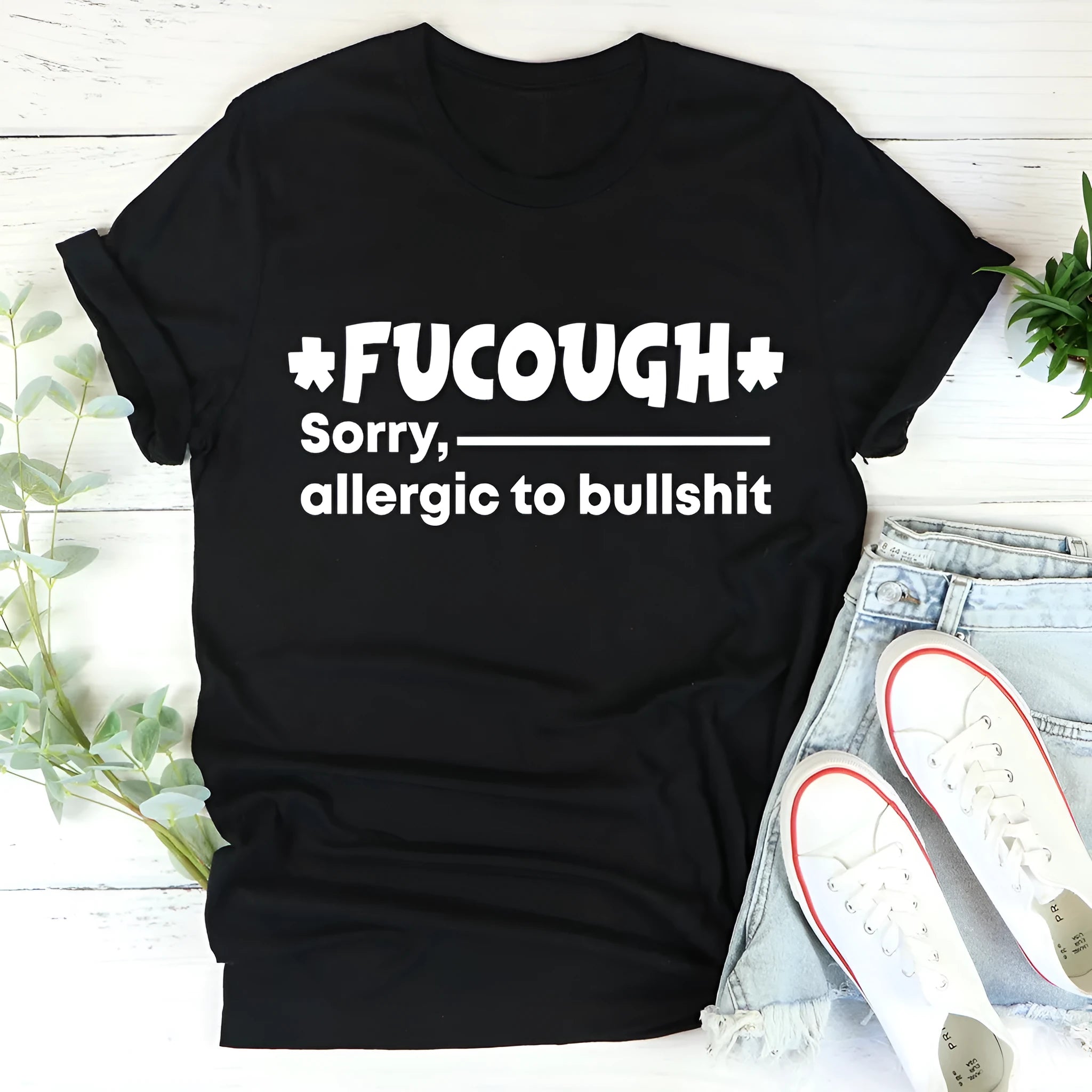 Black cotton t-shirt with loose fit and short sleeves showing straight cut design and round neck