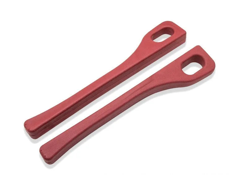 Two polyresin car seat gap sealing strips in chosen colour, showing integrated handle.