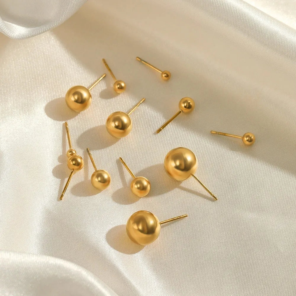Simple stainless steel stud earrings geometric sphere design available in gold and steel colours multiple sizes