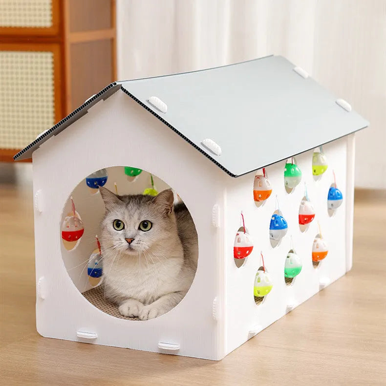 White plastic integrated cat scratch board with attached enclosed nest and curving tunnel toy for indoor cats.