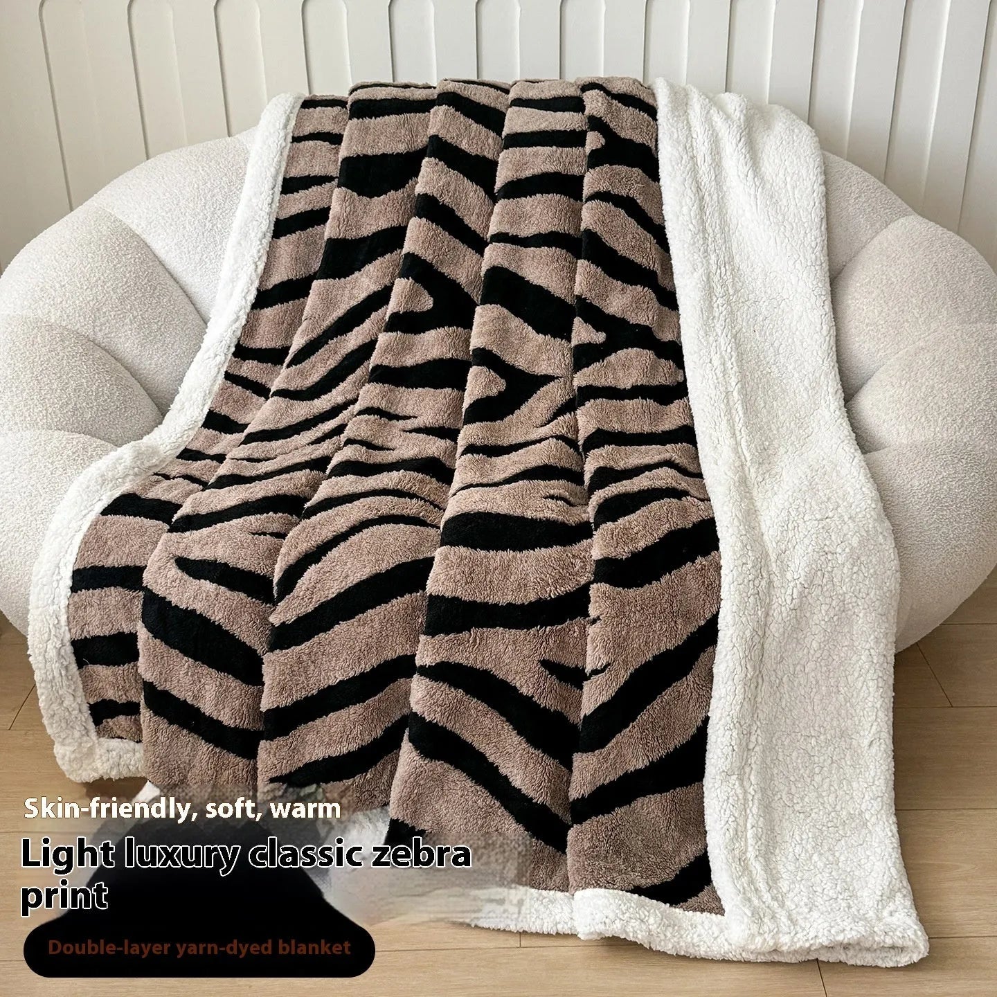 Double-layer taffeta blanket with woven leopard print pattern draped over sofa