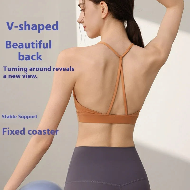 Women's nylon sports vest with fixed double-shoulder straps on a hanger