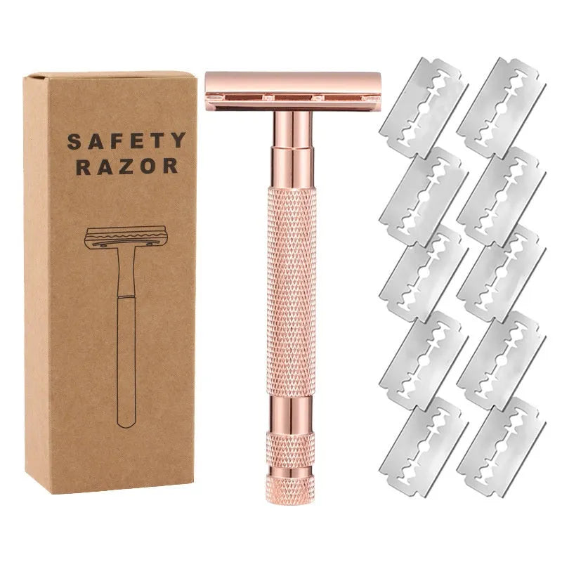 Manual double-sided safety razor with alloy handle, shown with replacement blades on a towel.