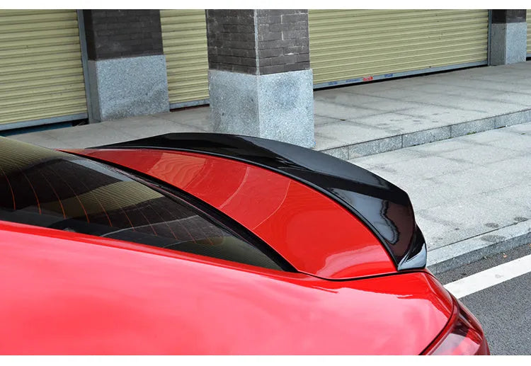Mazda 3 Exela tail trim blade in bright black finish for 2014-2021 models