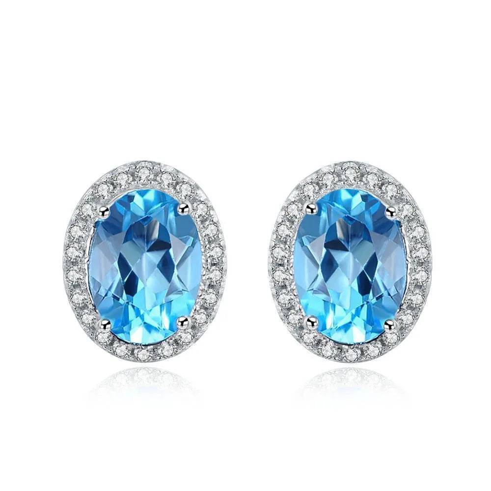 925 Sterling Silver four-piece jewellery set with Blue Topaz gemstones including earrings, ring, pendant and necklace