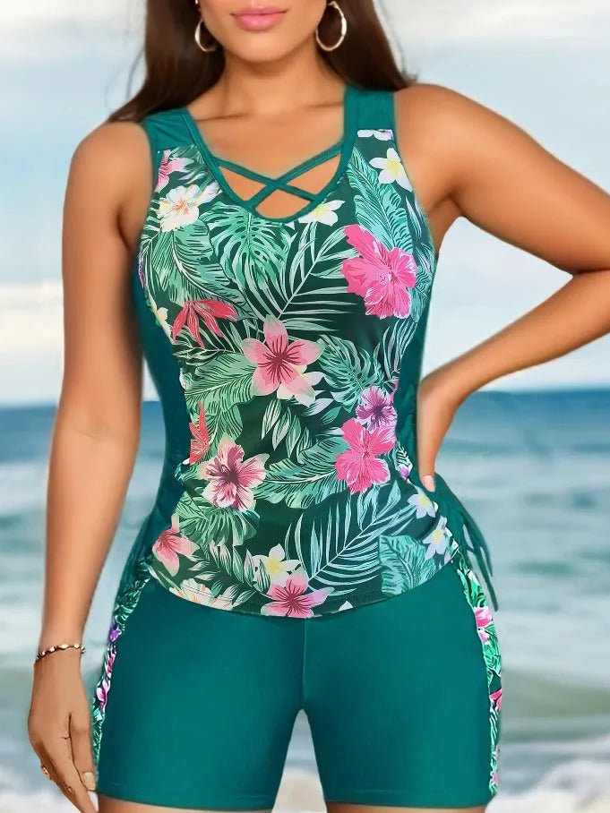 Plus size women's floral print bikini swimsuit with high waist briefs on a mannequin.