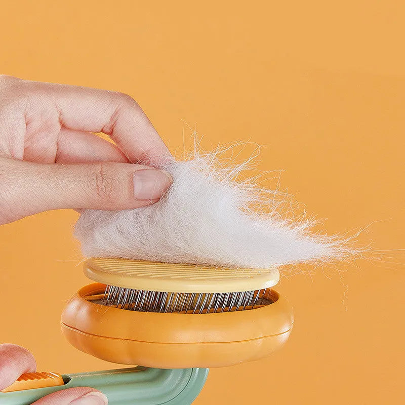 Self-cleaning pet cat brush with 232 steel needles in white or pumpkin colour, hand-held grooming tool