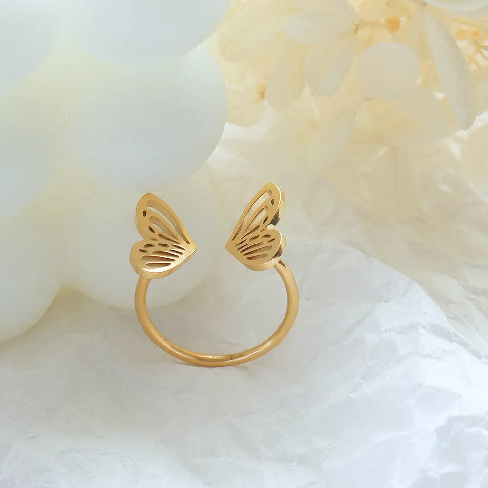 Titanium steel hollow butterfly ring with adjustable opening in gold colour