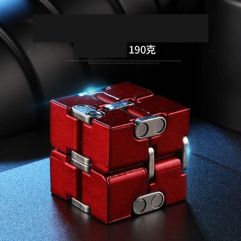 Black zinc alloy infinity cube fidget toy showing eight connected cubes.