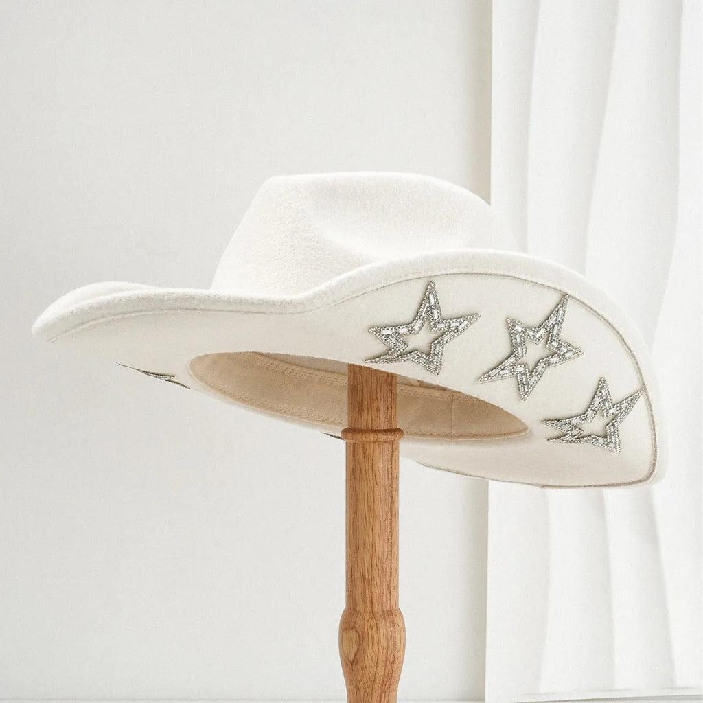 Beige polyester Western-style top hat with a conical crown and a silver hexagonal star decoration on the front.