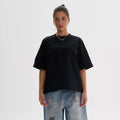 Men's loose fit pure cotton t-shirt in apricot colour on a hanger