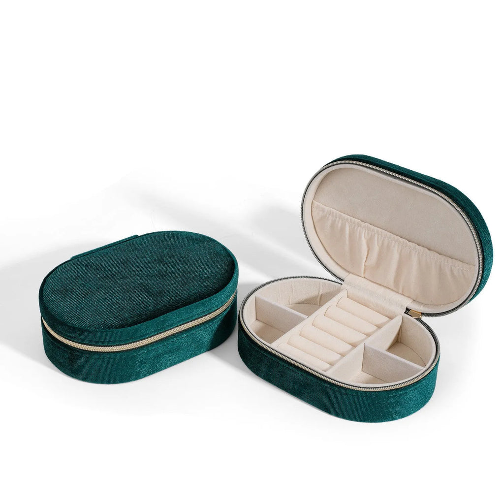 Oval velvet jewellery storage box in multiple colours with flannel lining, showing compact 15x10x5 cm size.