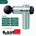Konka professional electric mini massage gun in grey with multiple massage heads on a table