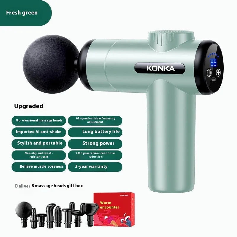Konka professional electric mini massage gun in grey with multiple massage heads on a table