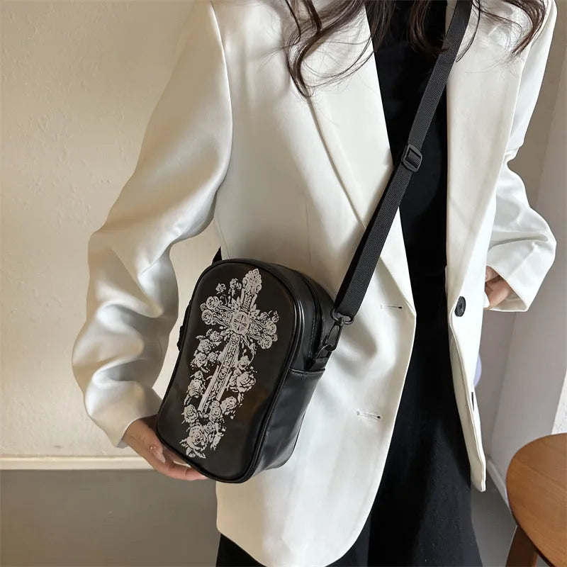 Halloween graffiti print crossbody phone bag with cartoon pumpkins, in multiple colours.