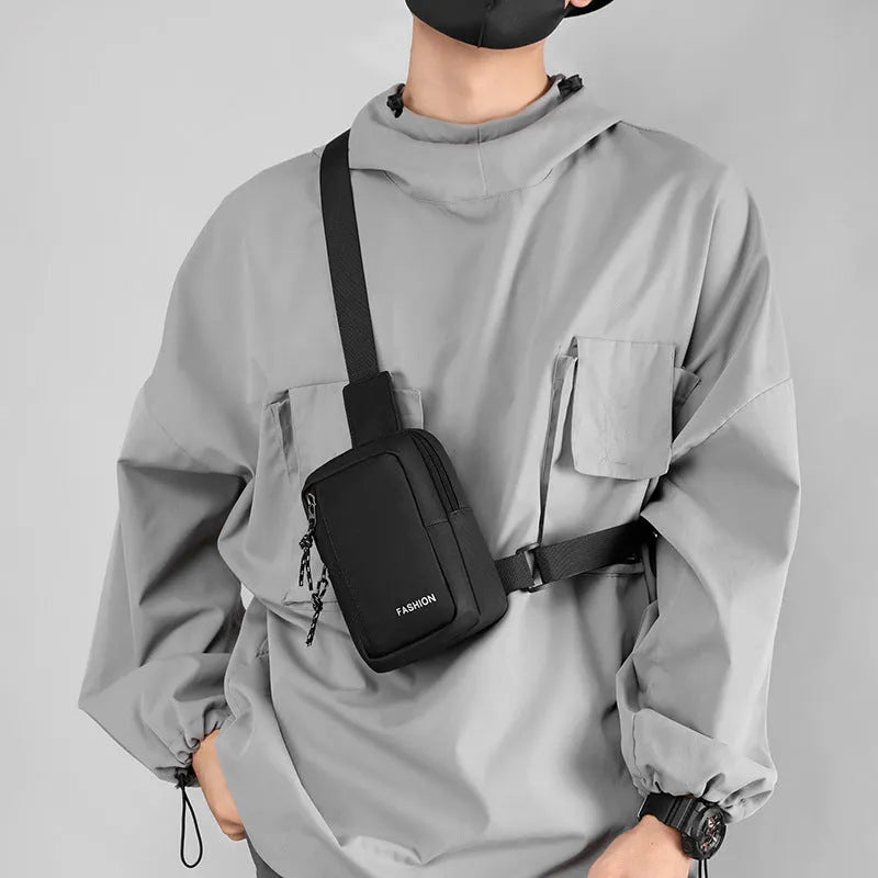 Large capacity nylon crossbody bag for men, vertical square shape, black colour, sewing line details, medium-soft structure