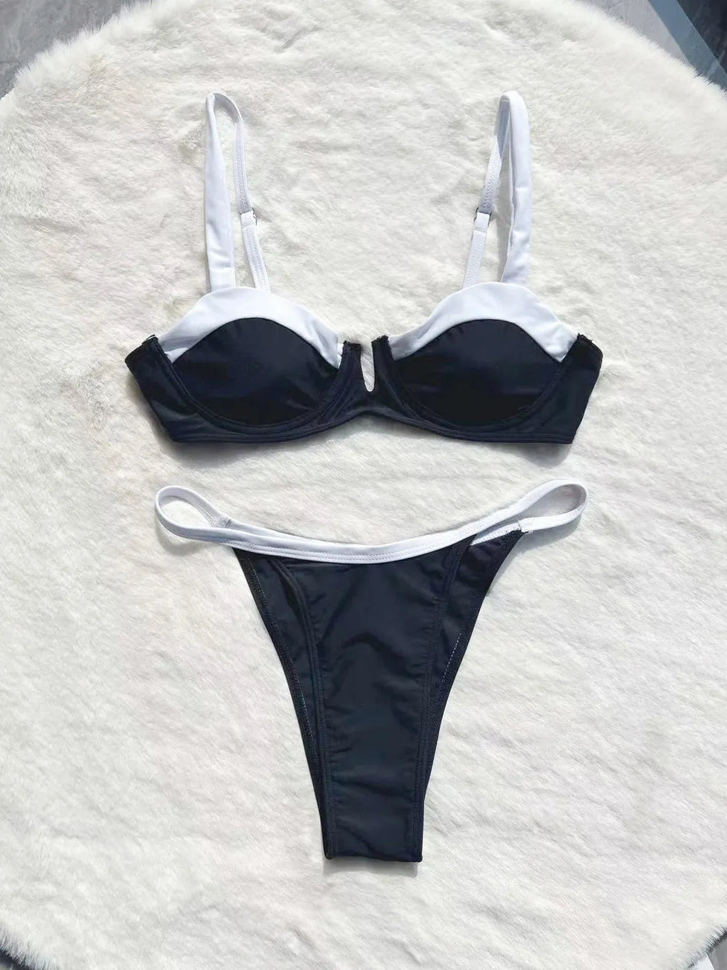 Black low waist women's bikini with stitching split design and brief style
