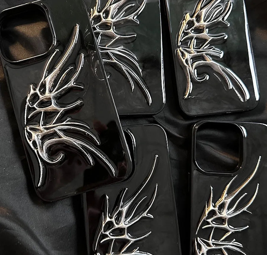 Black iPhone case with three-dimensional wings design showing textured surface