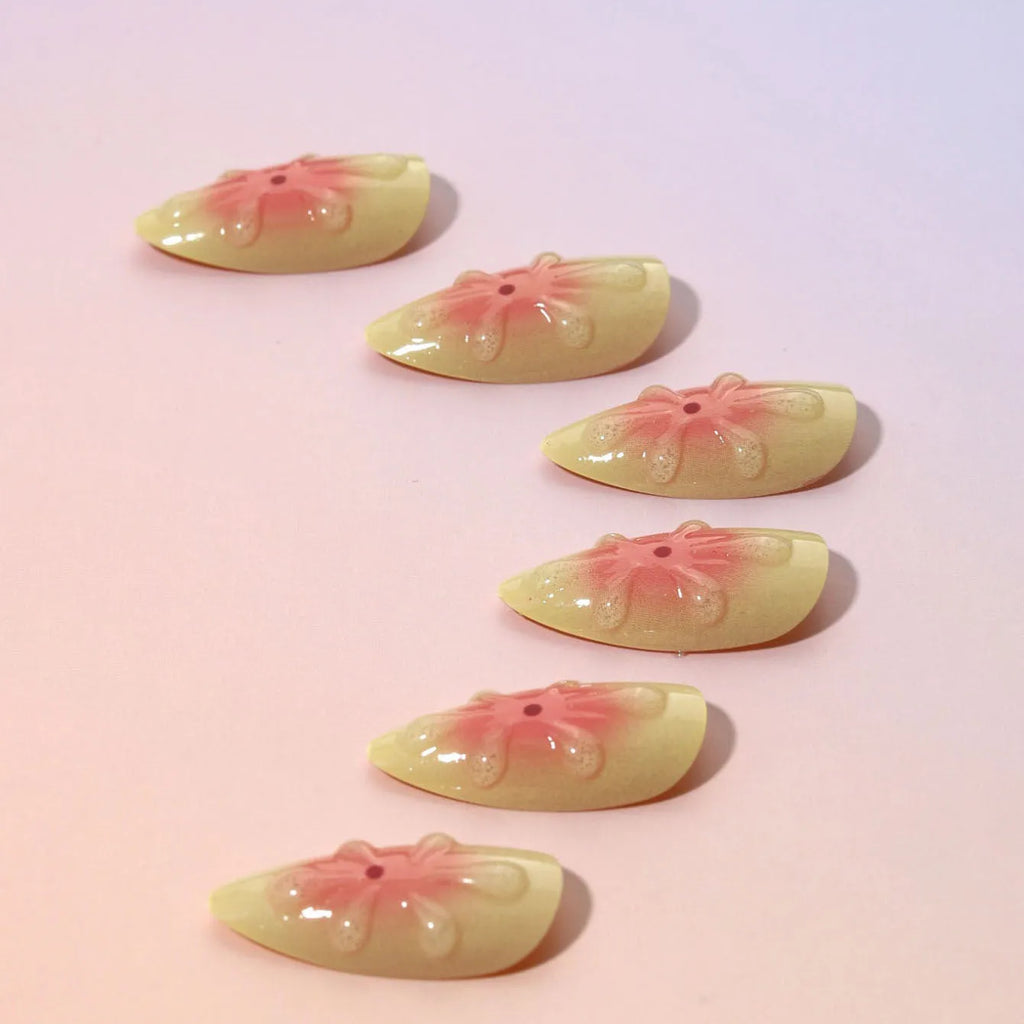 Set of detachable fake nails with 3D cartoon flower design on plastic armour, includes jelly glue.