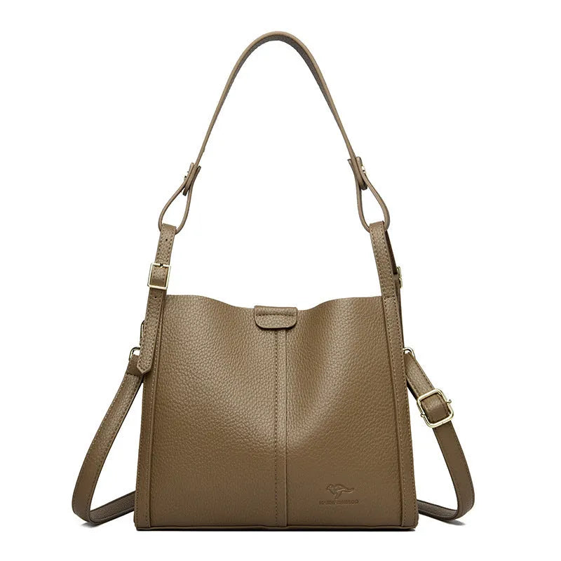 Brown retro ladies shoulder bag with zip compartments showing vertical square shape and single strap