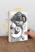 8K thickened sketchbook open on a table with marker drawings, showing linen and black card cover options.
