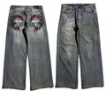 Grey washed-out men's wide-leg jeans with a straight cut on a neutral background.