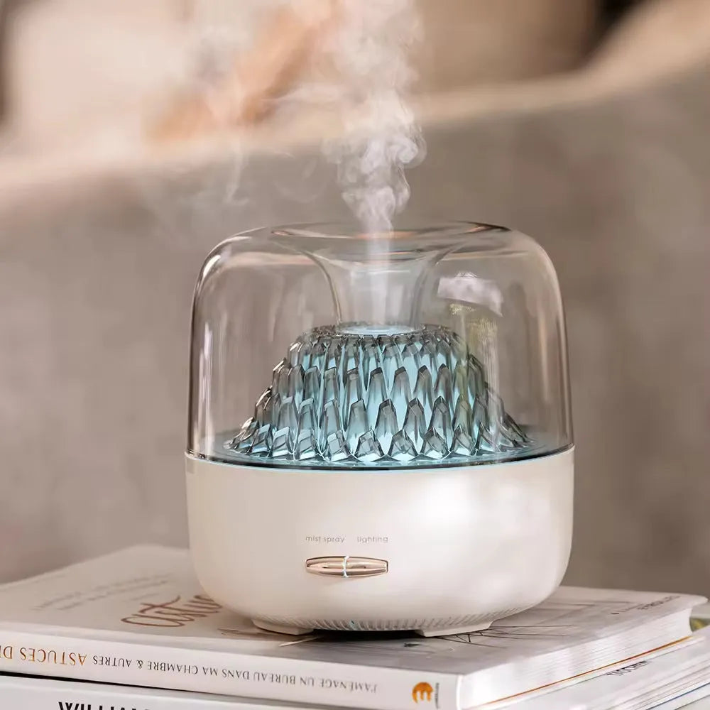 Round beige resin aroma diffuser with one fog outlet and colourful light on a desktop