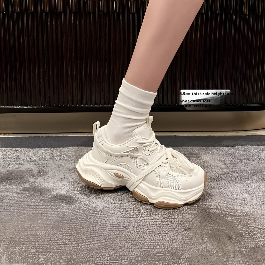 Women's beige and white platform sneakers with round toe and front lace-up design on a composite sole.