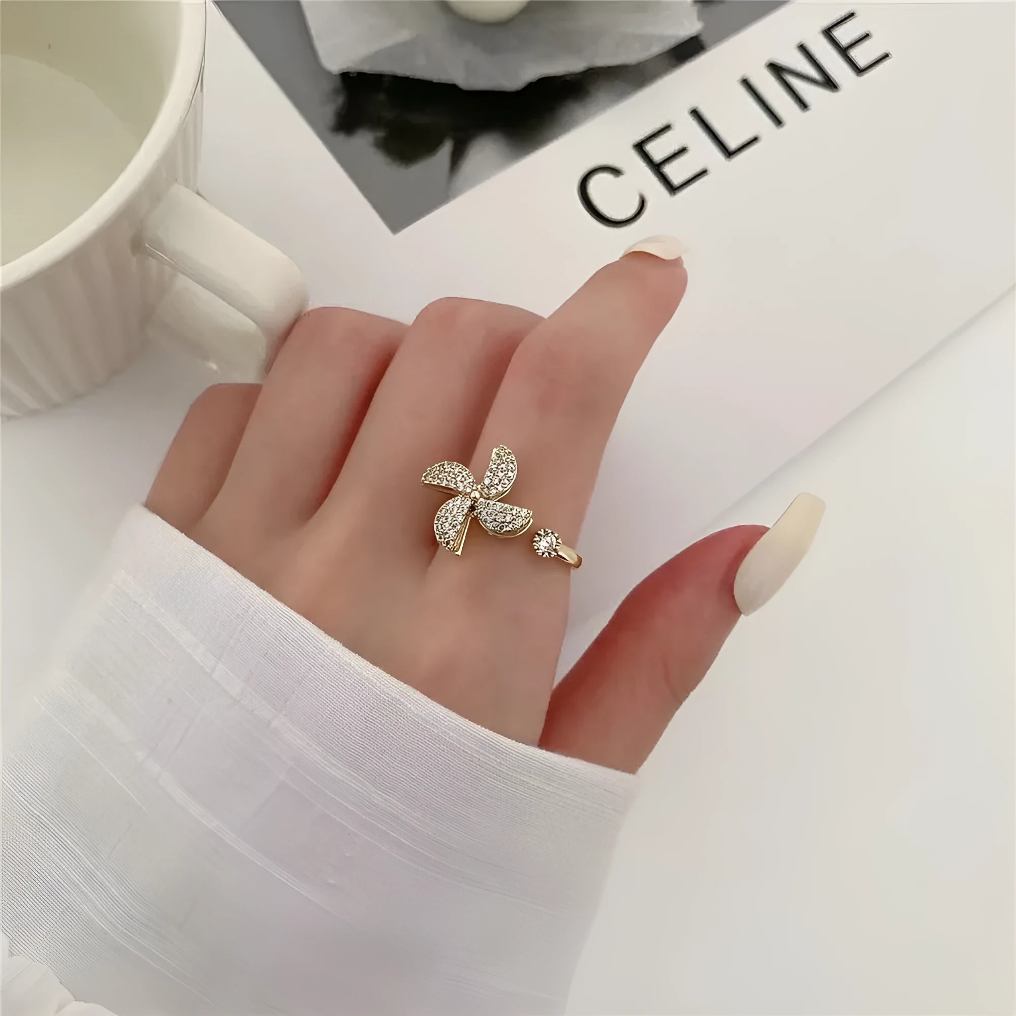 Rotating micro inlaid ring with spinning windmill design in gold or silver finish