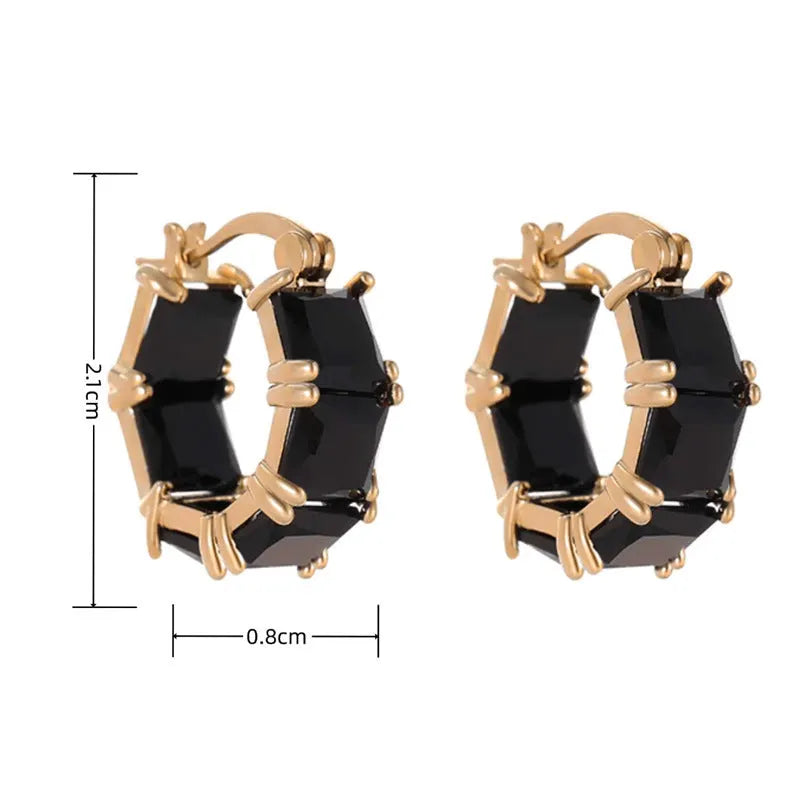 Gold geometric U-shaped women's earrings with a round black crystal zirconium stone.