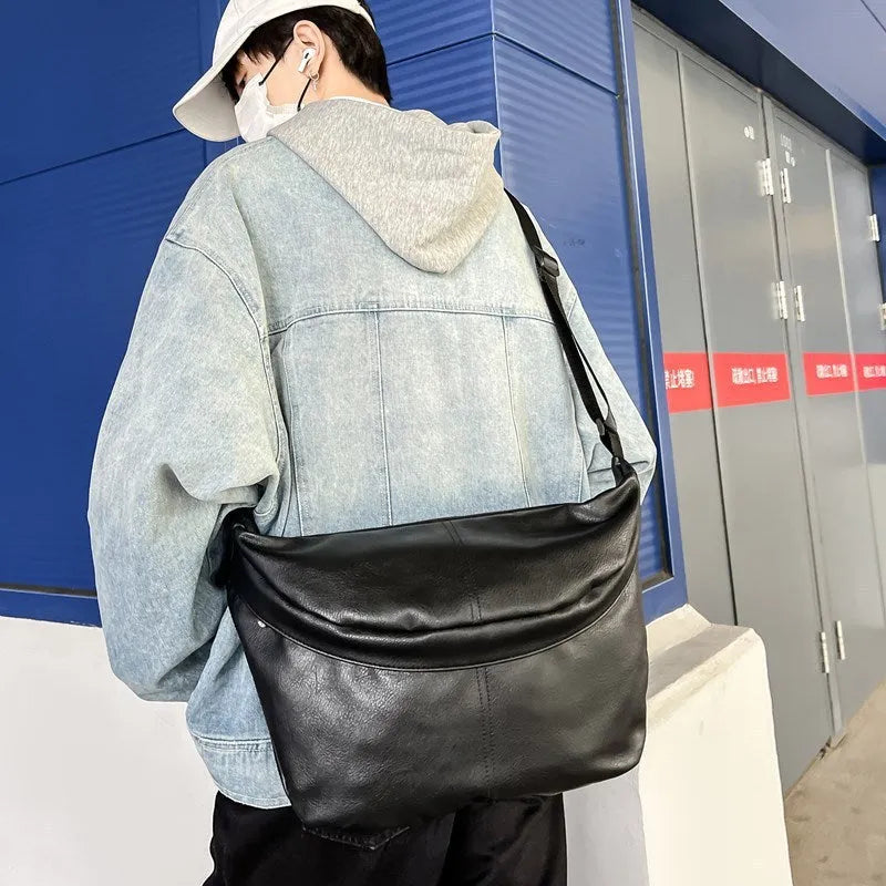 Men's brown retro crossbody bag showing 50cm width and PU leather construction