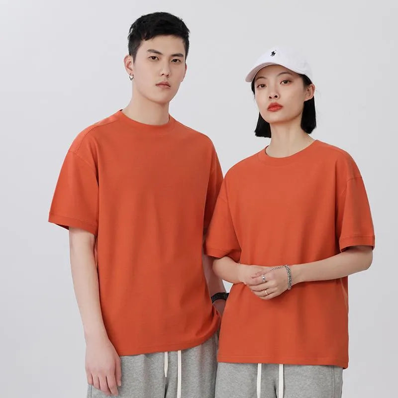 Men's loose grey cotton short-sleeved t-shirt on a hanger, casual summer wear.